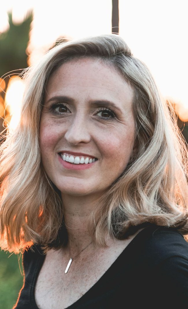 Smiling woman with a bright, healthy smile after dental implant treatment